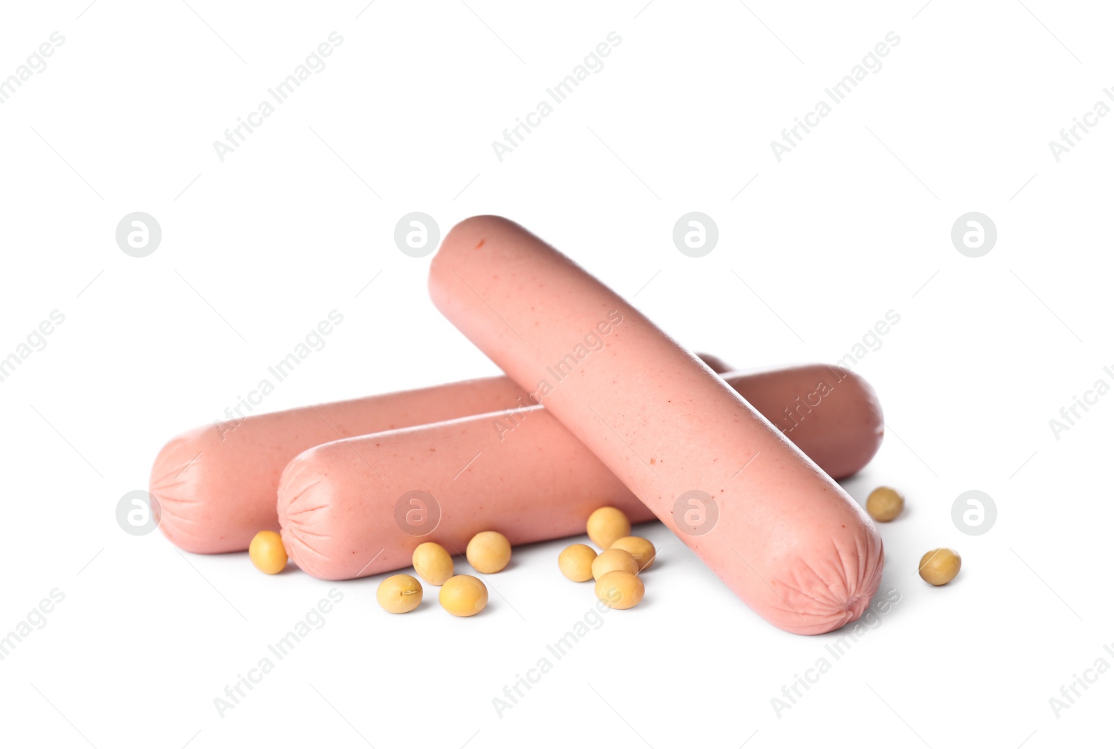 Photo of Raw vegetarian sausages and soybeans on white background