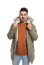 Photo of Young man wearing warm clothes on white background. Ready for winter vacation