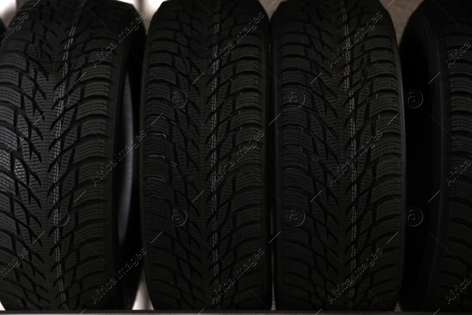 Photo of Car tires in auto store, closeup view