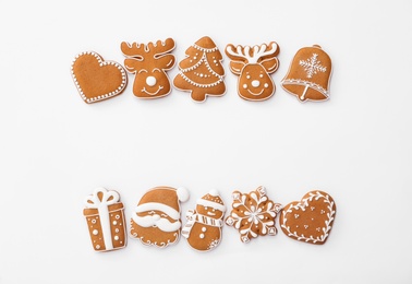 Photo of Different Christmas gingerbread cookies on white background, top view