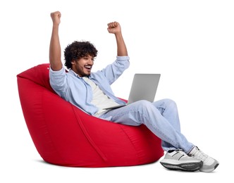 Photo of Happy man with laptop sitting on beanbag chair against white background