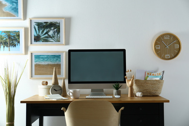 Photo of Modern computer and office supplies on wooden table, space for text. Designer's workplace