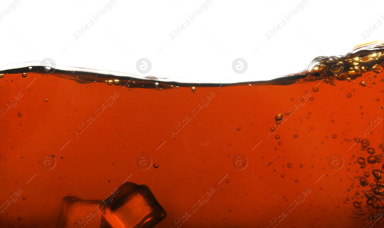 Photo of Closeup view of tasty refreshing cola with ice cubes on white background