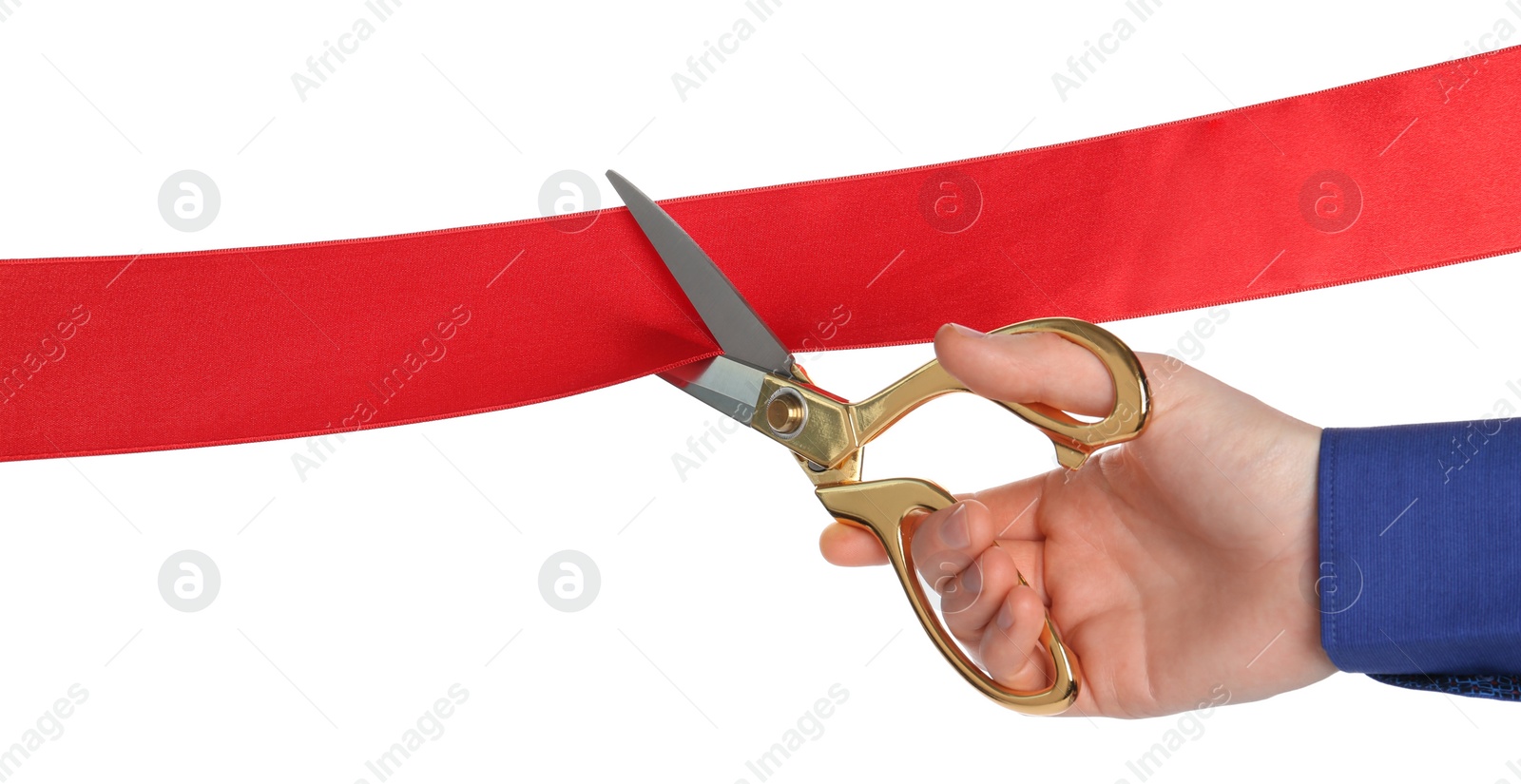 Photo of Man cutting red ribbon on white background, closeup