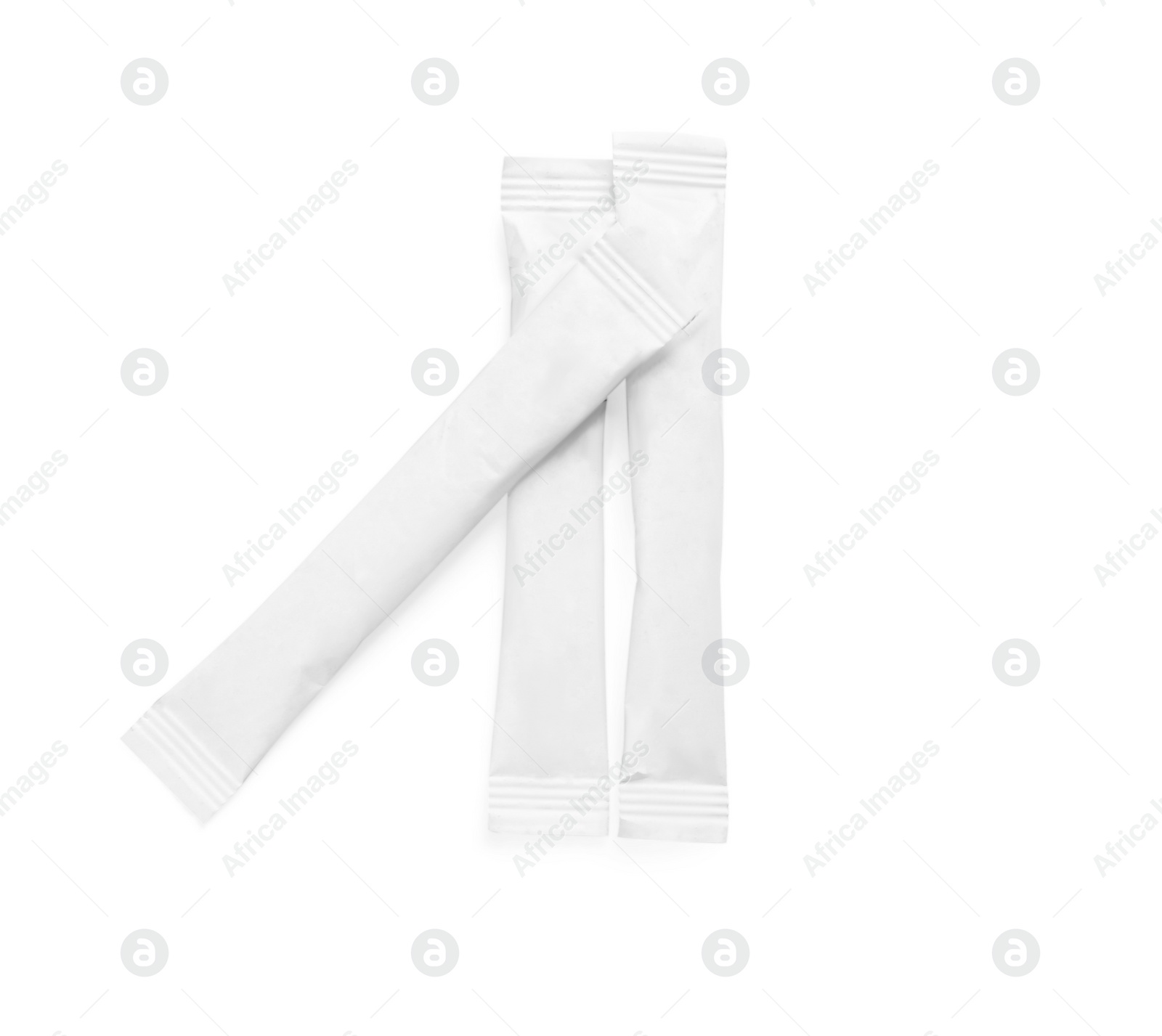 Photo of Paper sticks of sugar on white background, top view