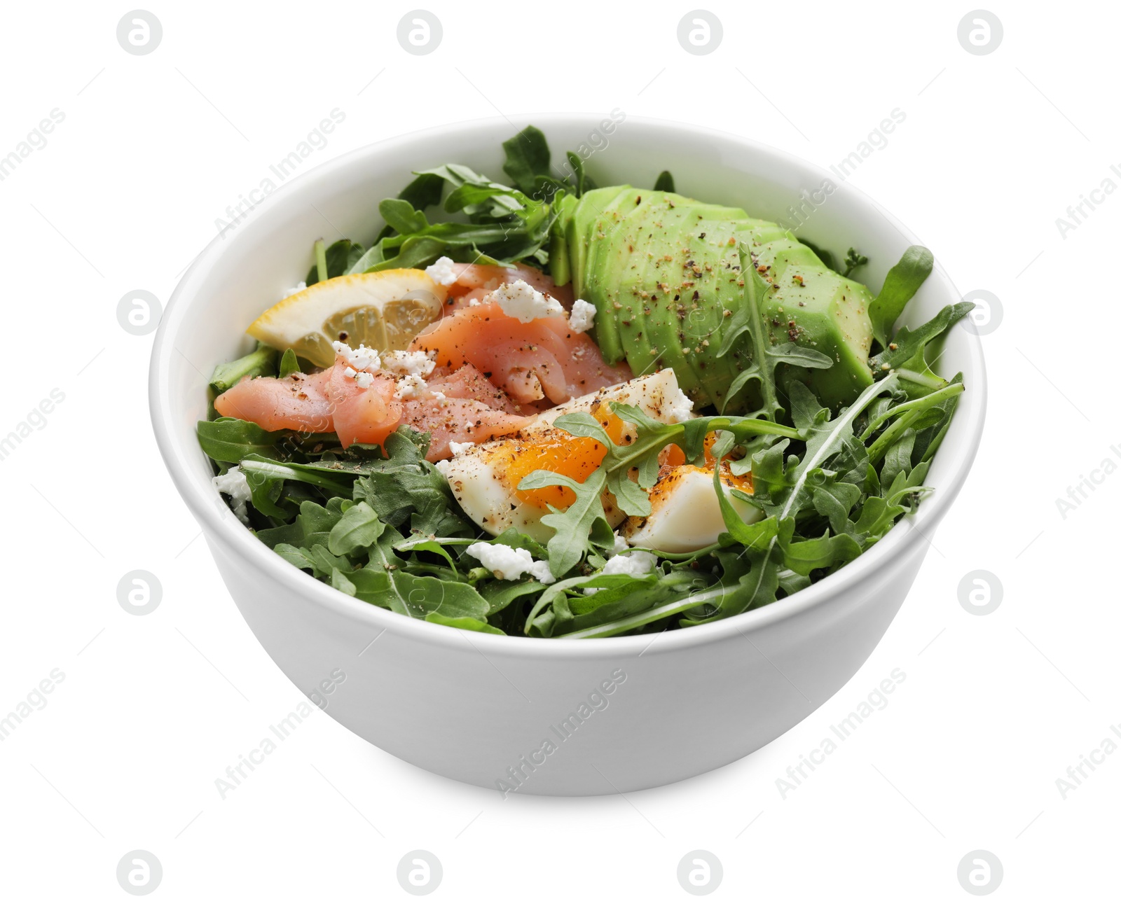 Photo of Delicious salad with boiled egg, salmon and avocado in bowl isolated on white