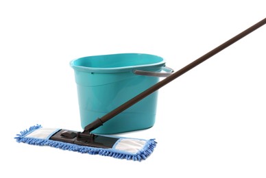 Photo of Mop and plastic bucket on white background. Cleaning service