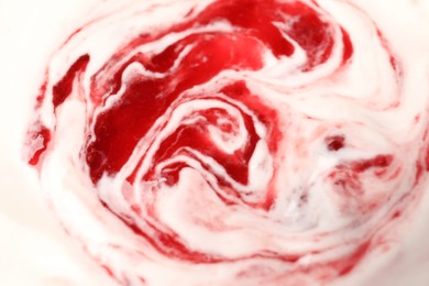 Tasty yogurt with jam as background, closeup