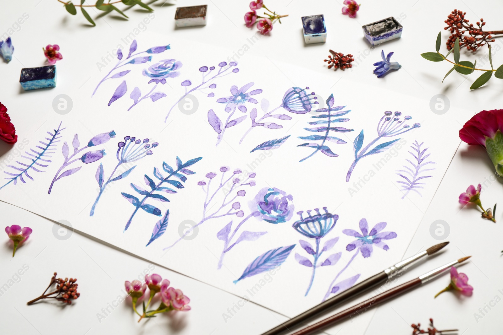 Photo of Composition with floral picture and watercolor paints on white background