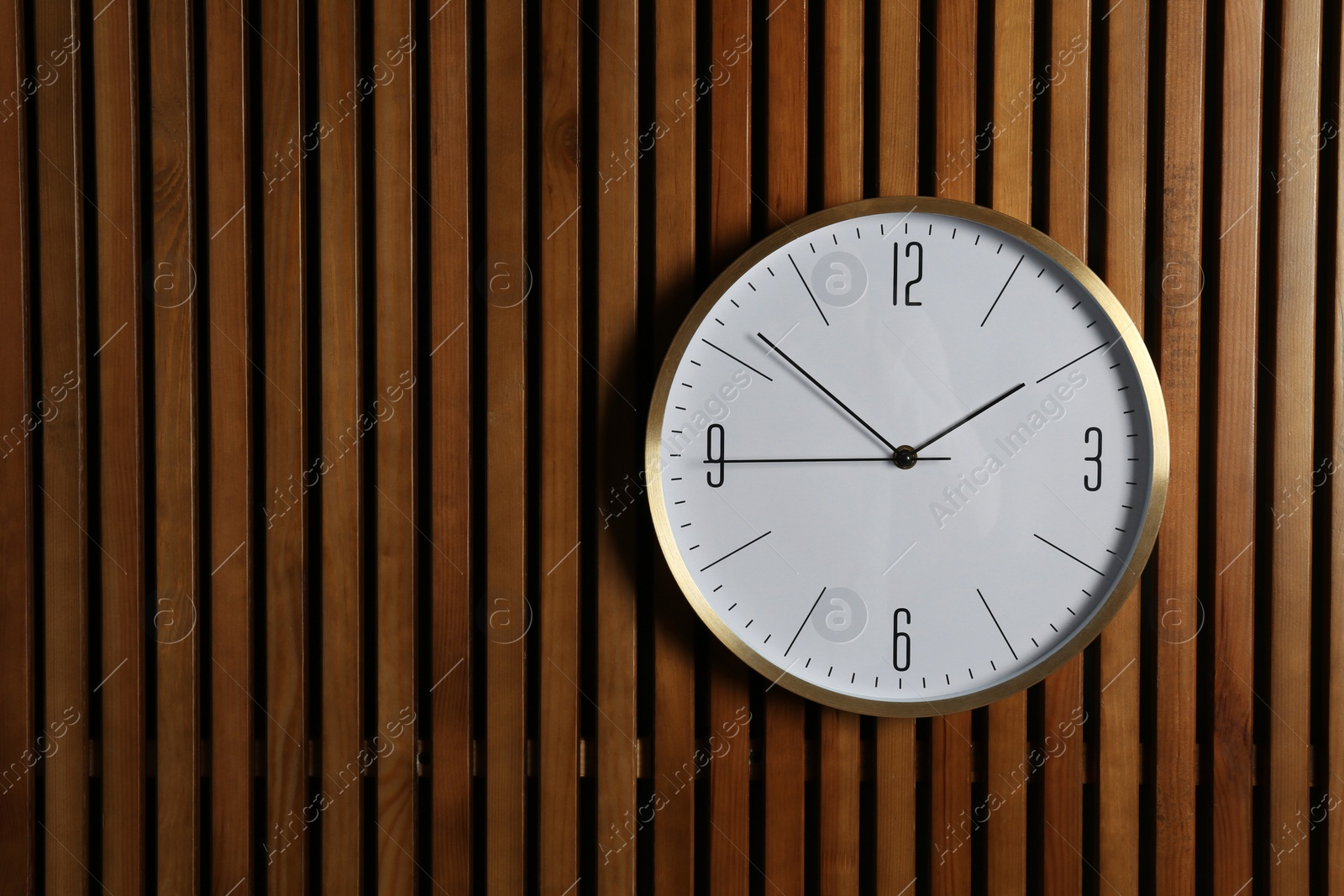 Photo of Stylish clock and space for text on wooden background. Time management