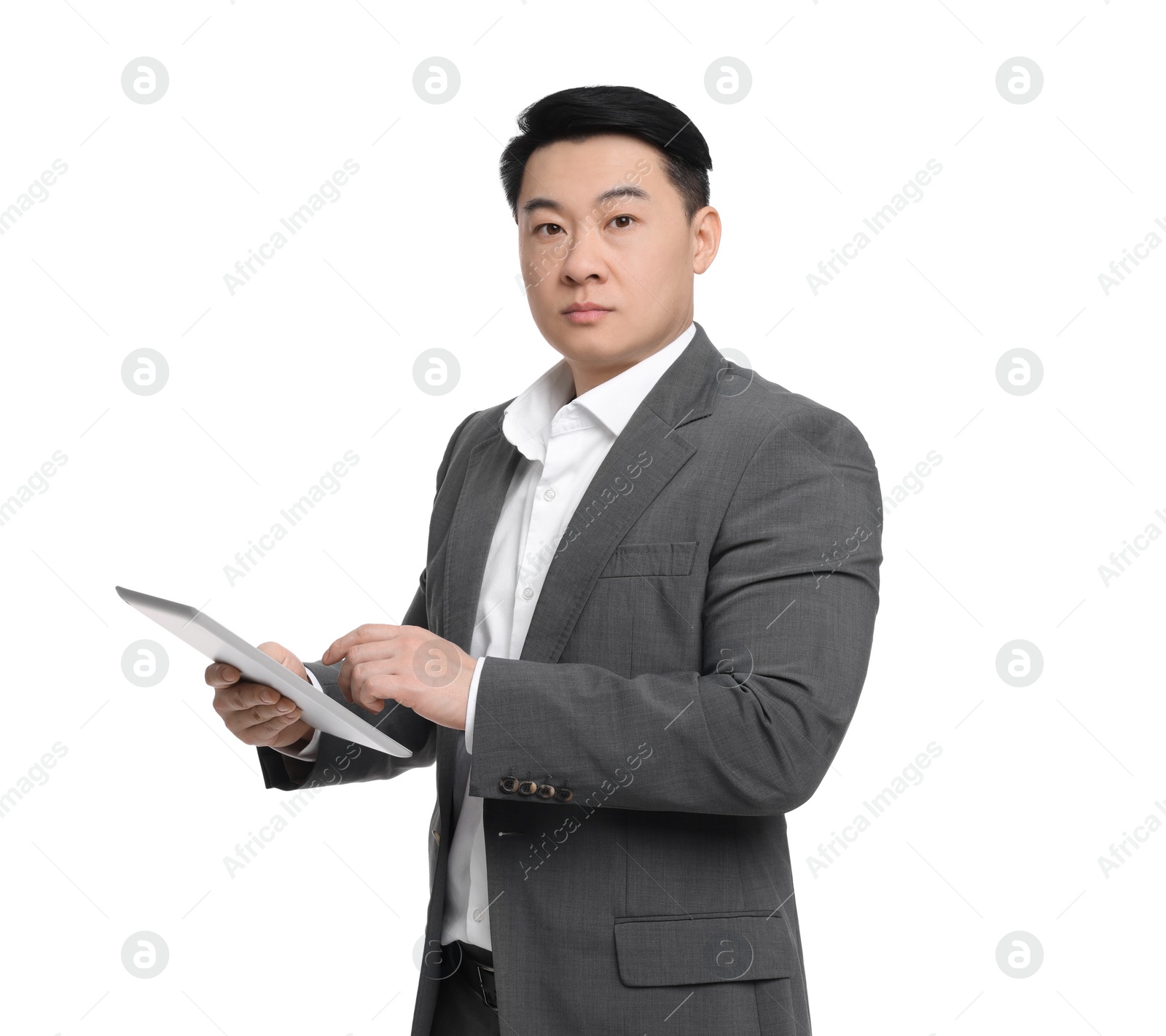 Photo of Businessman in suit with tablet on white background