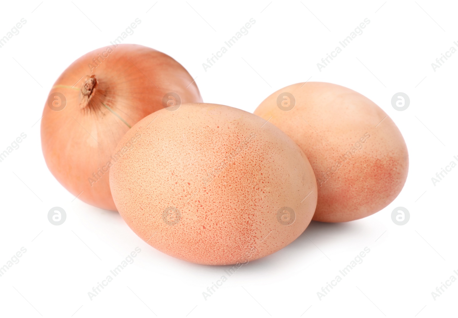 Photo of Easter eggs painted with natural dye and onion on white background