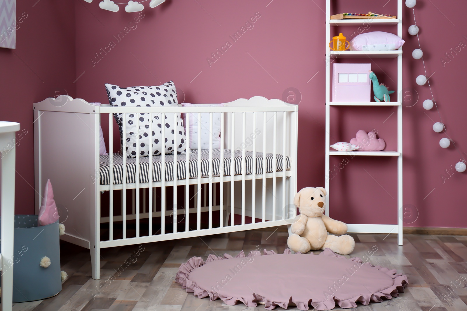 Photo of Stylish baby room interior with crib