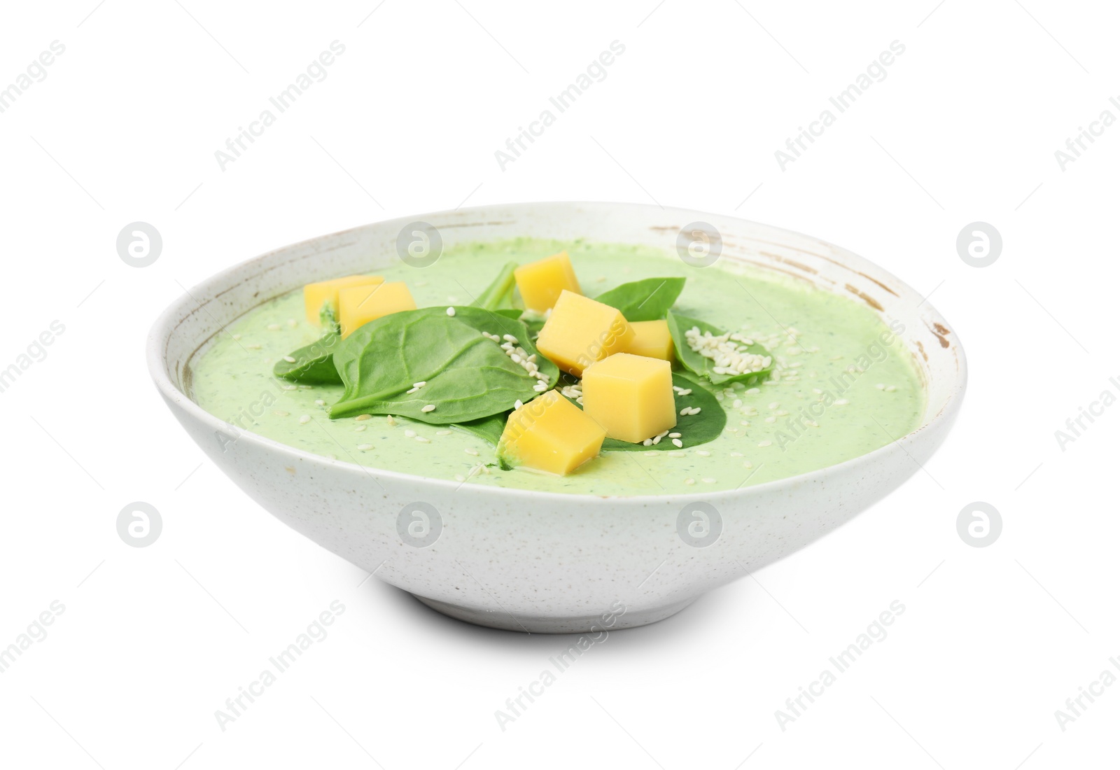 Photo of Delicious spinach cream soup with cheese and sesame seeds in bowl isolated on white