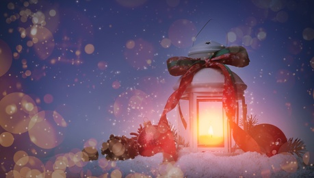 Image of Composition with Christmas lantern on snow, space for text. Magical atmosphere 