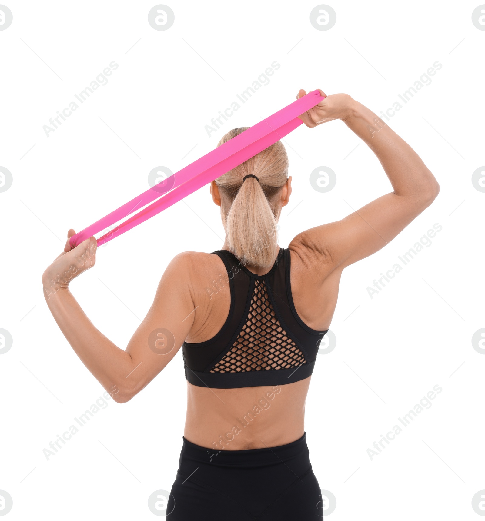 Photo of Woman exercising with elastic resistance band on white background, back view