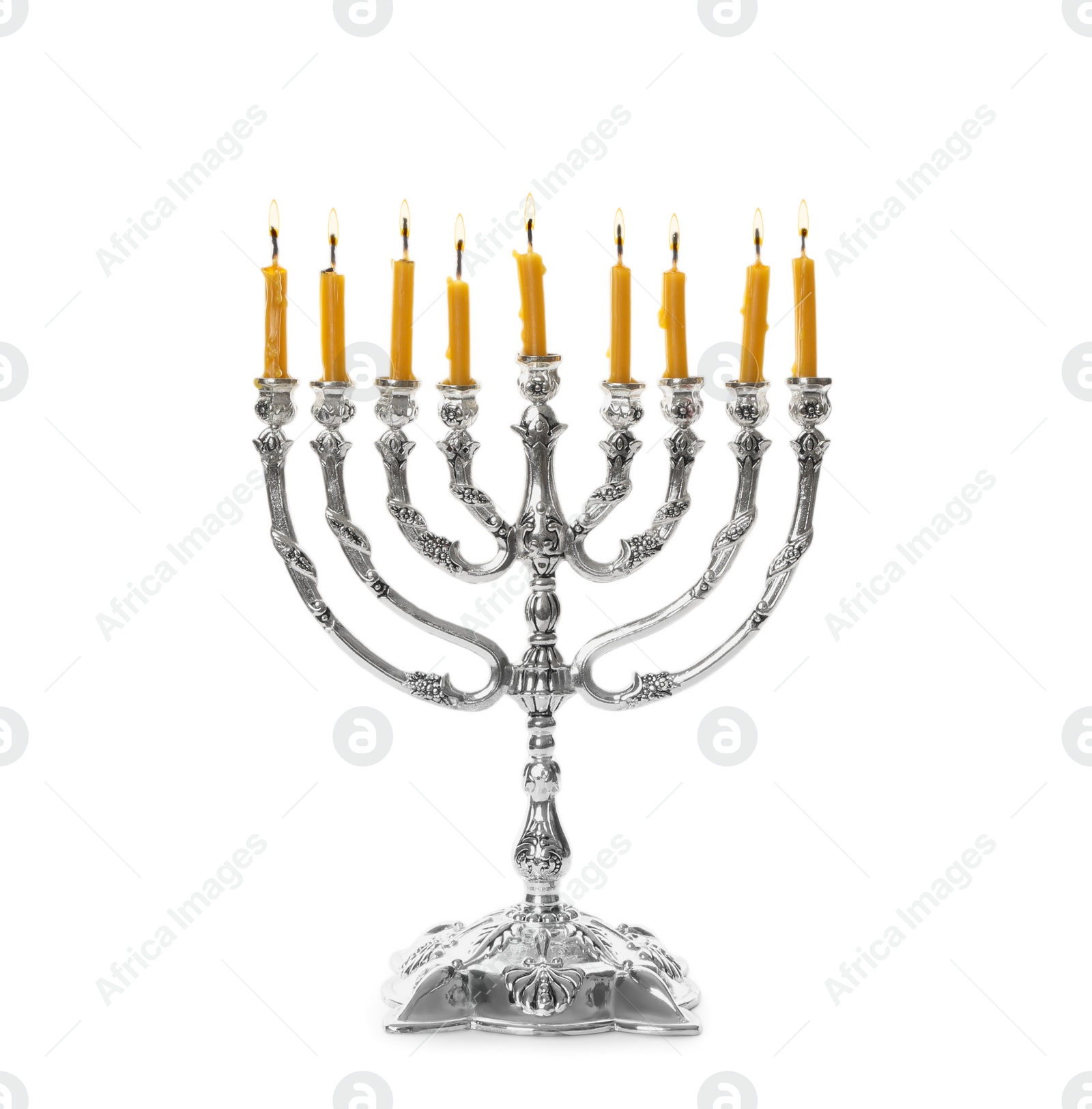 Photo of Silver menorah with burning candles on white background. Hanukkah celebration