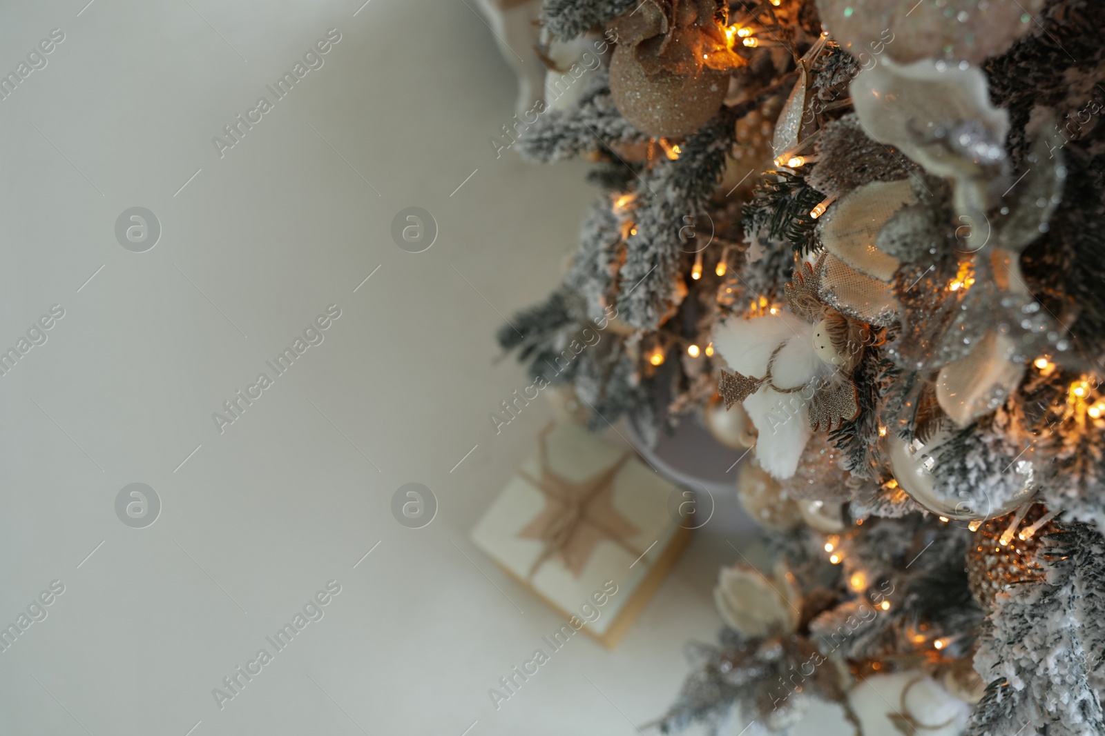 Photo of Beautiful Christmas tree, above view with space for text. Festive interior decoration