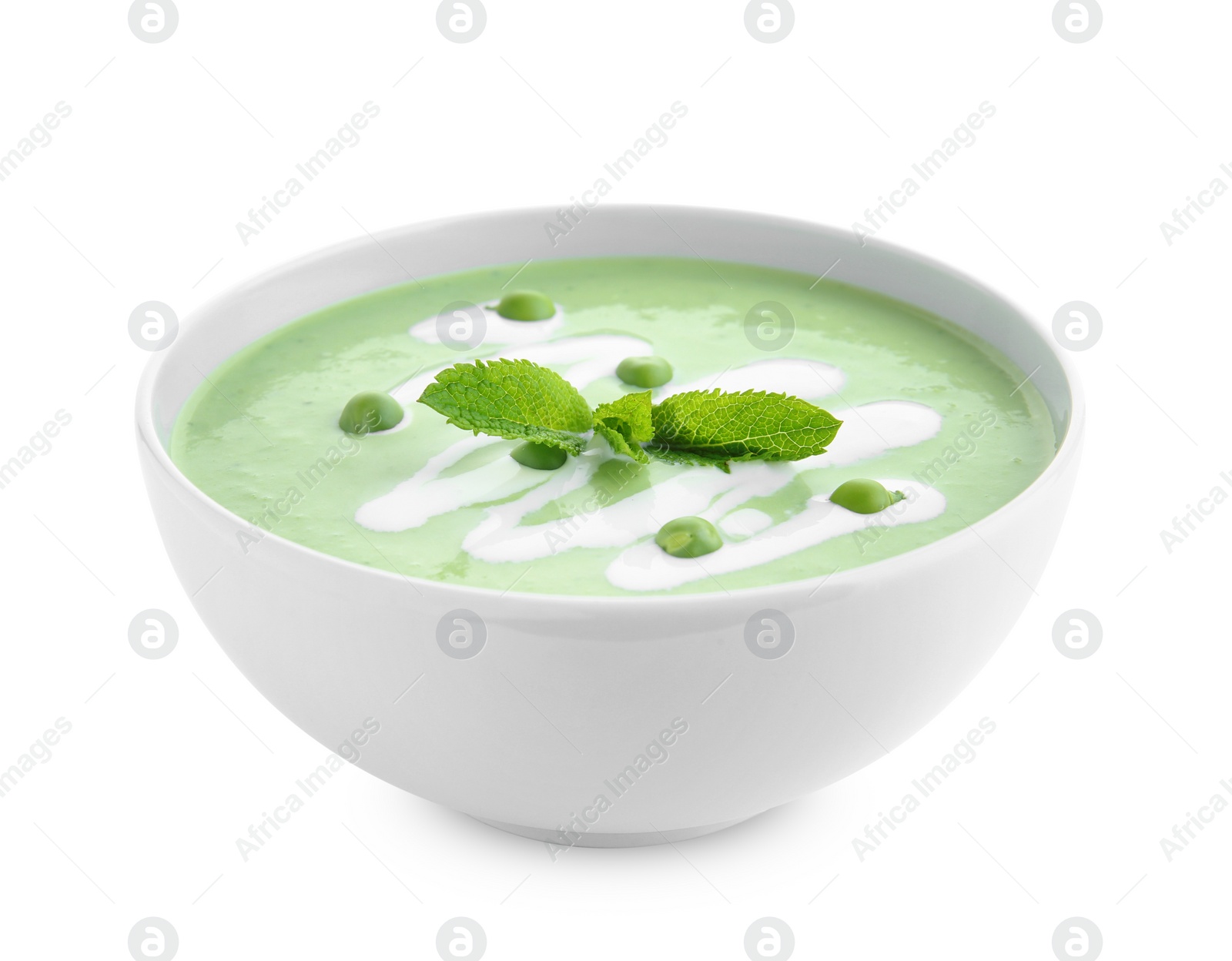 Photo of Green pea soup in bowl on white background