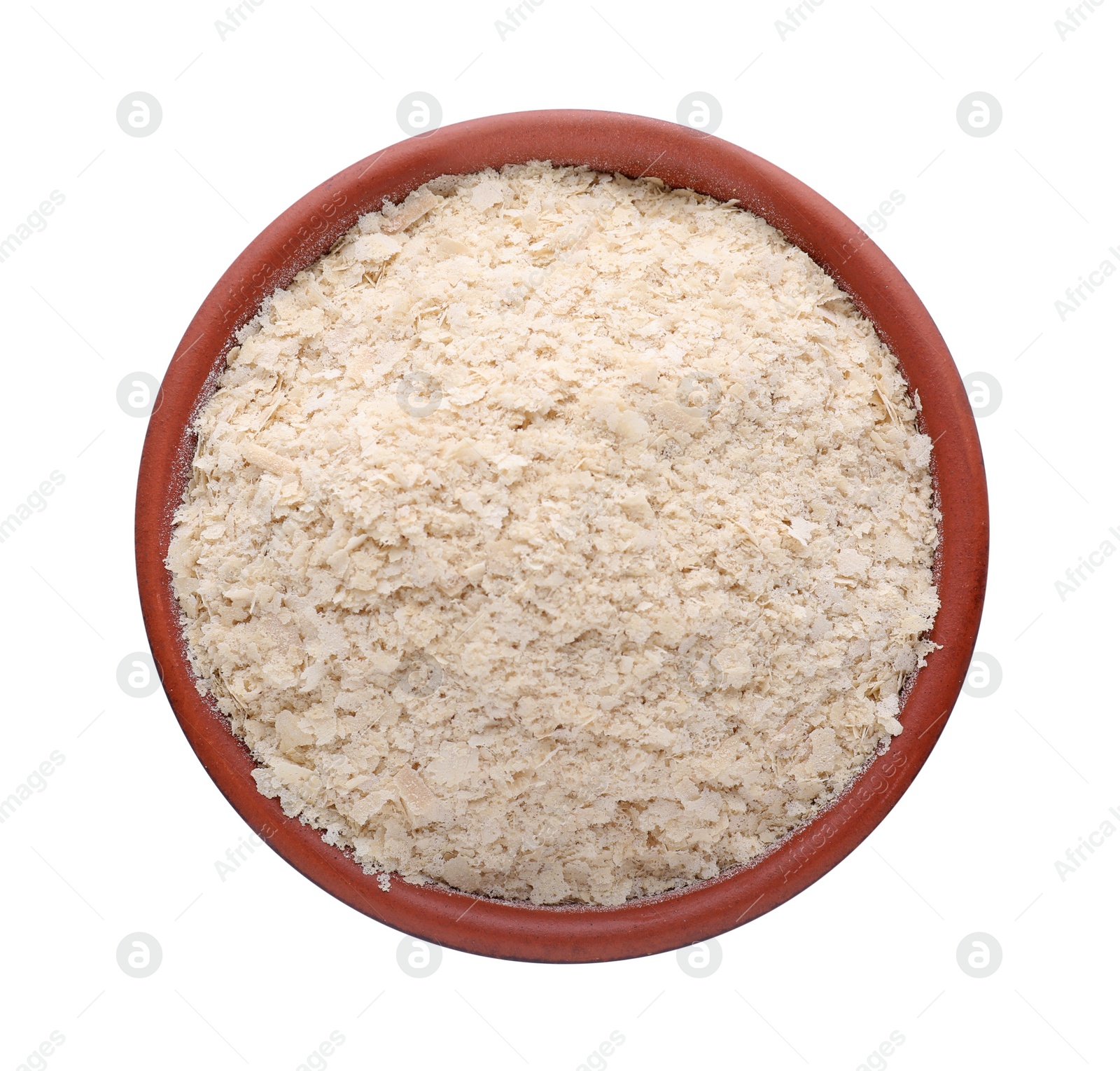 Photo of Brewer's yeast flakes in bowl isolated on white, top view