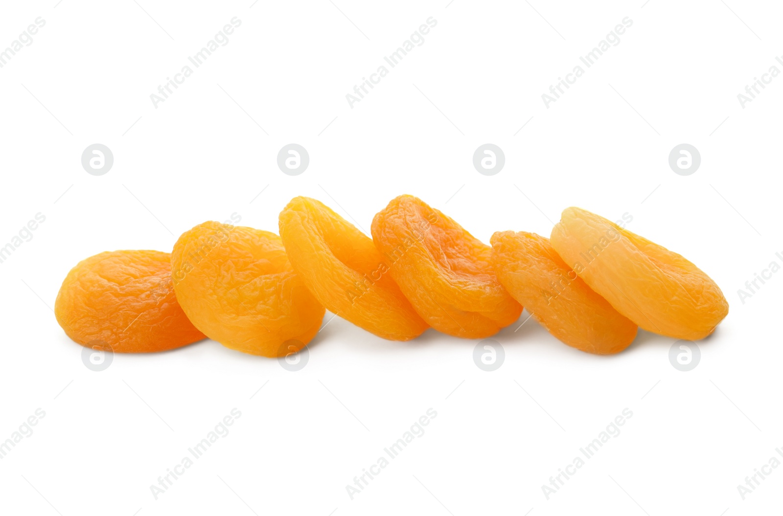 Photo of Pile of tasty apricots on white background. Dried fruits