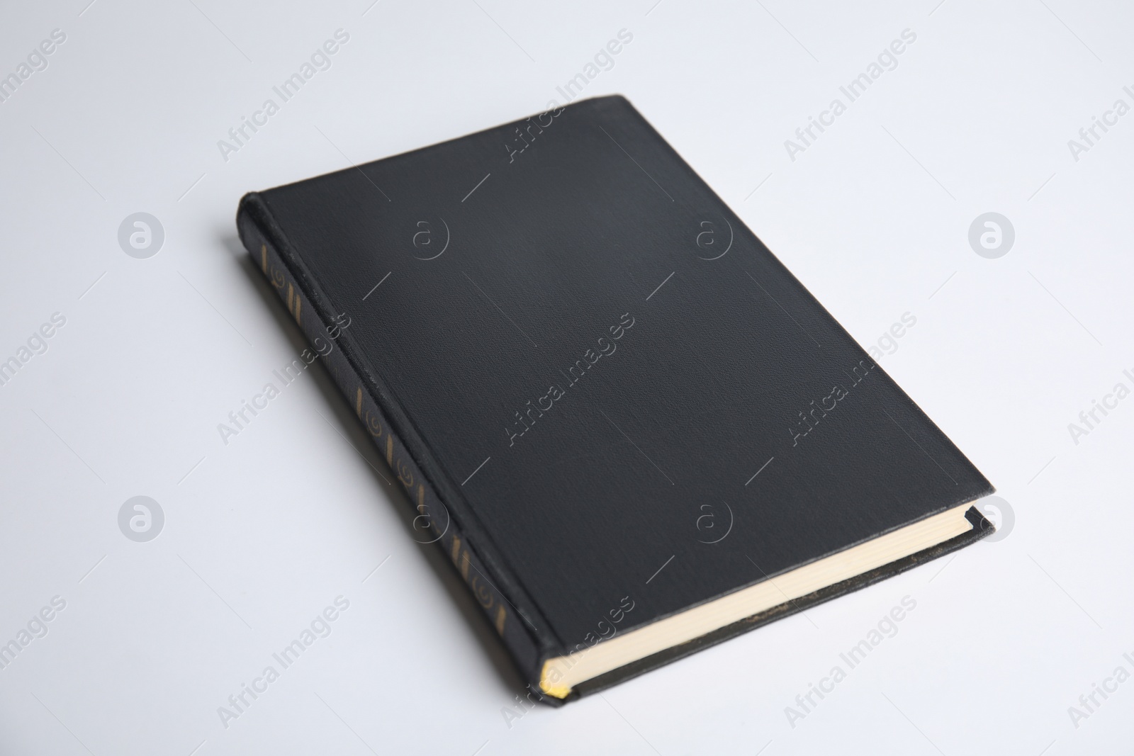 Photo of Hardcover book on white background. Space for design