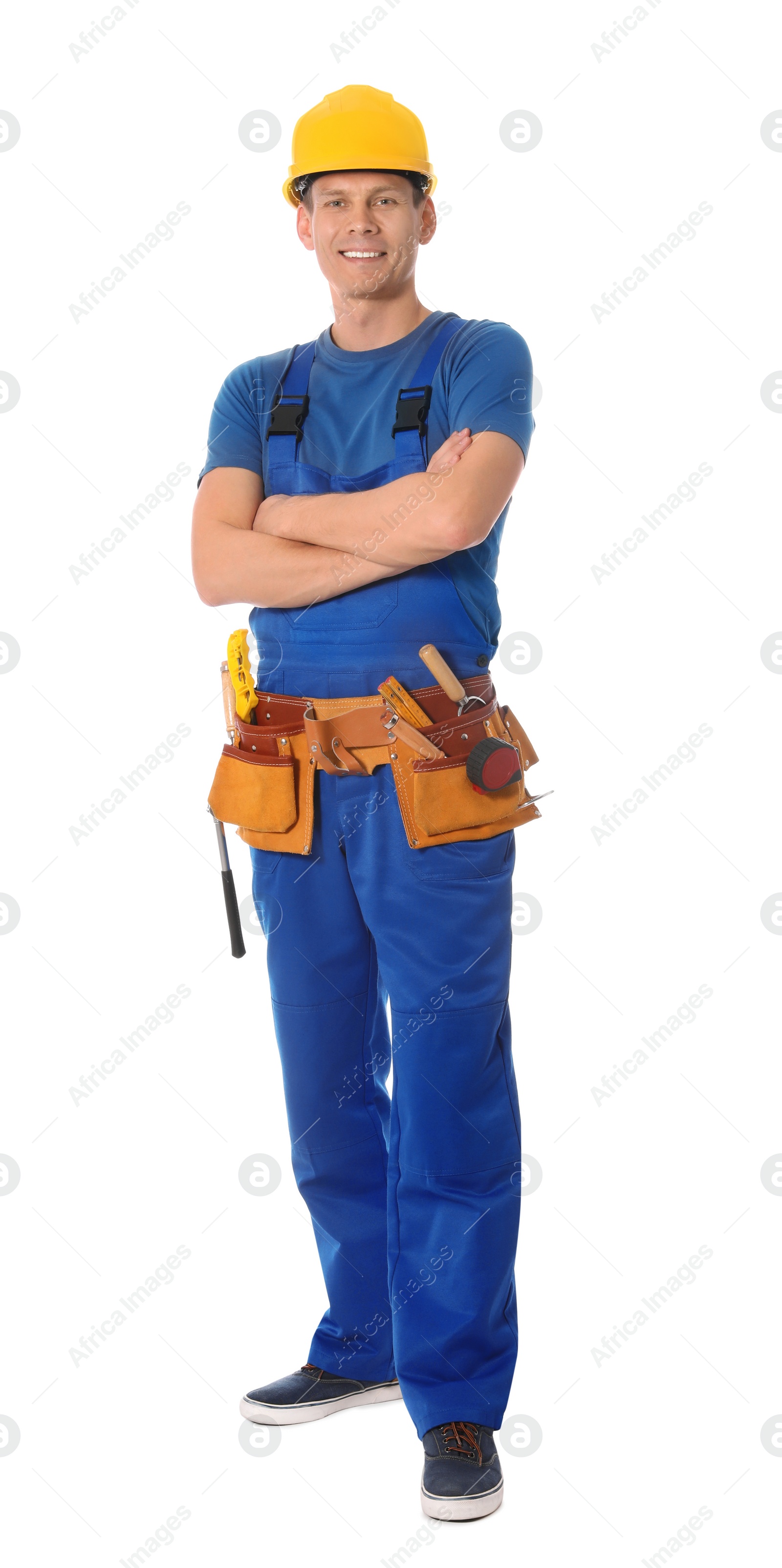 Photo of Handsome carpenter with tool belt isolated on white