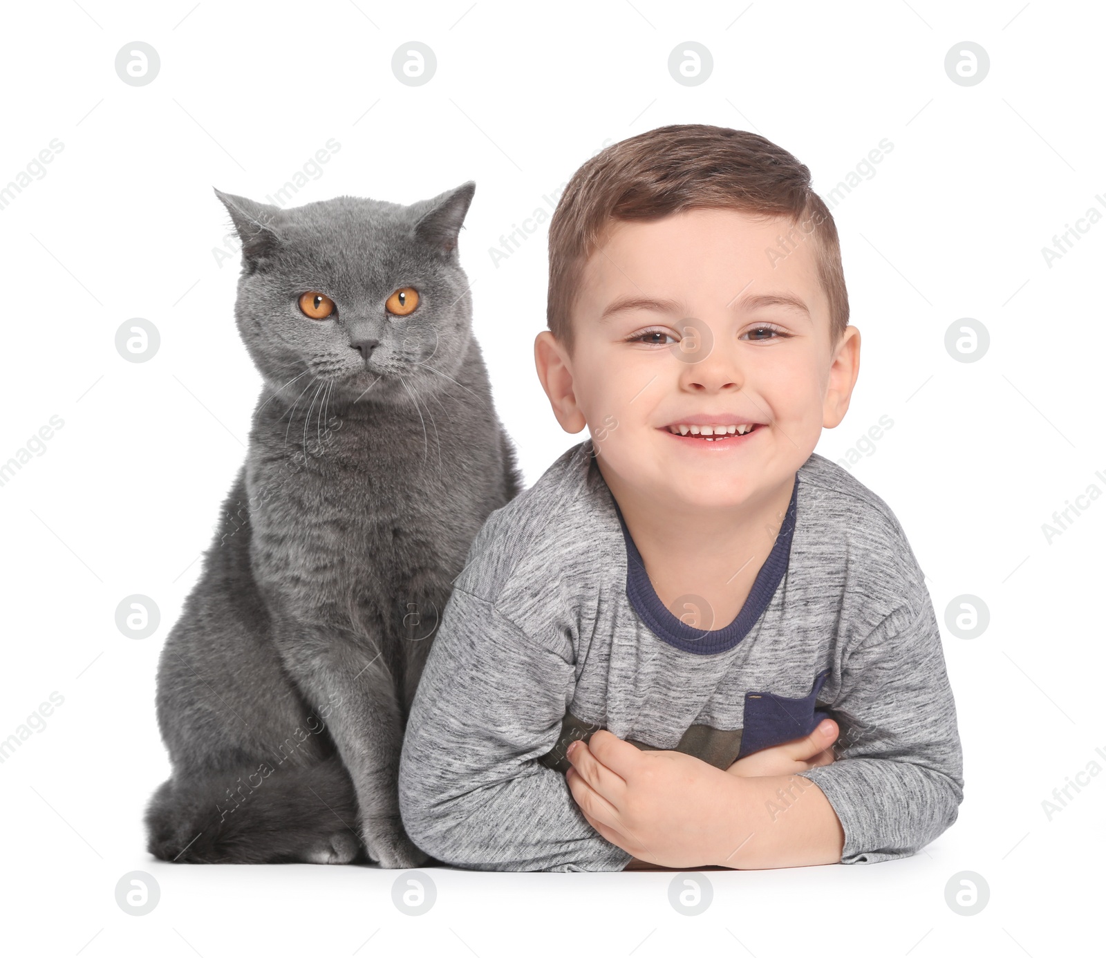 Photo of Cute little child with cat on white background