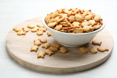 Photo of Delicious goldfish crackers in bowl on table