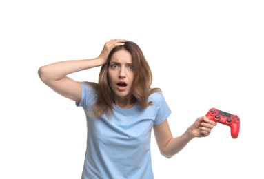 Photo of Shocked woman with game controller on white background