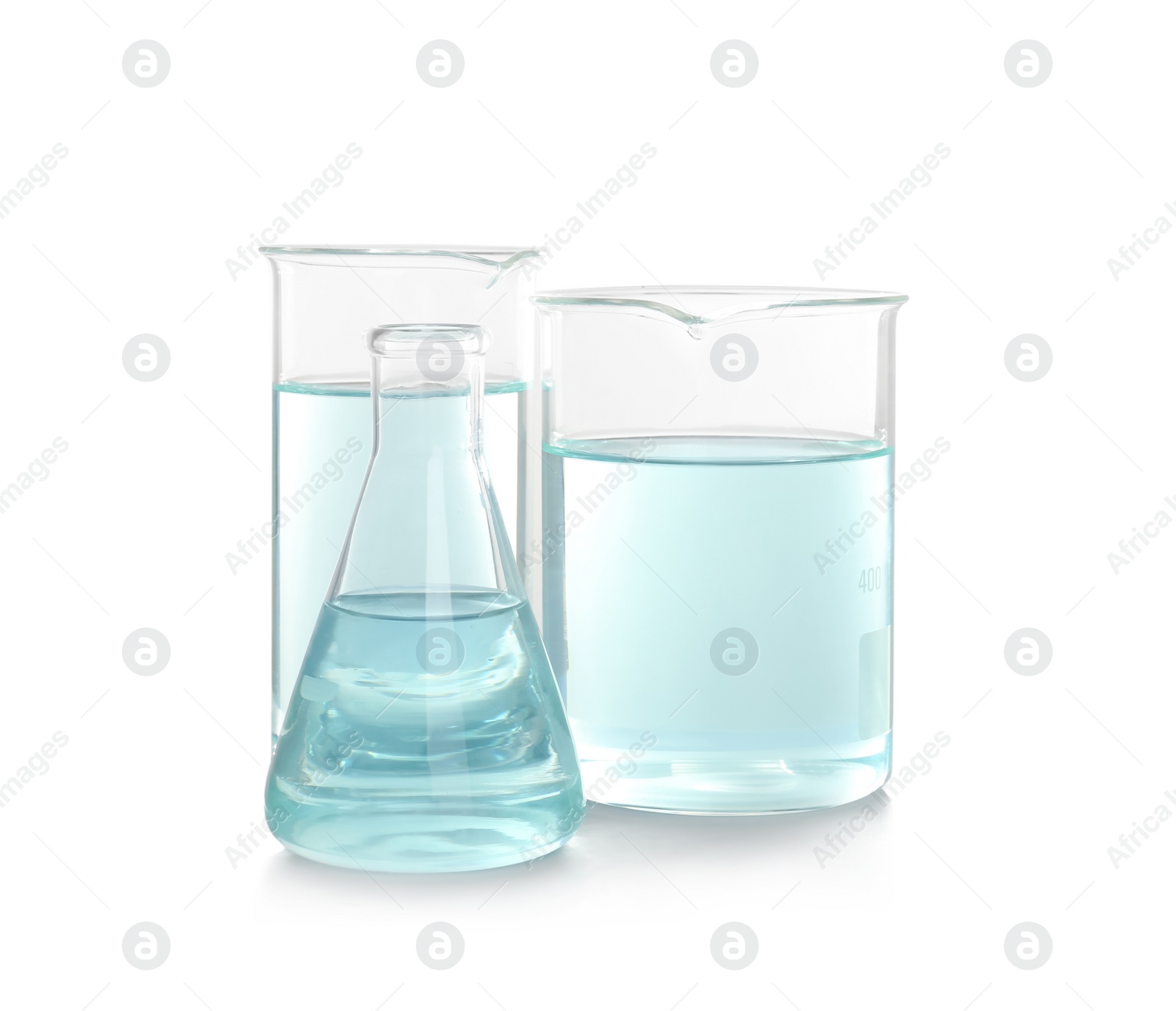 Photo of Laboratory glassware with liquid on white background. Chemical analysis