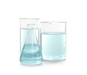 Photo of Laboratory glassware with liquid on white background. Chemical analysis