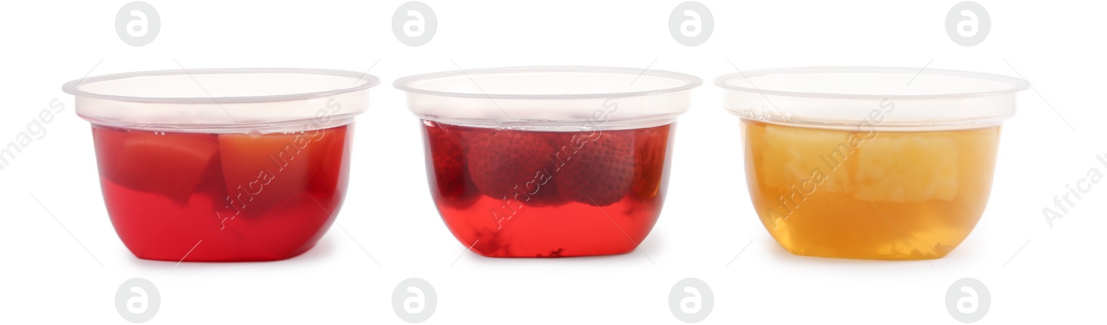 Photo of Tasty jelly desserts in plastic cups on white background