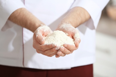 Man holding flour, closeup