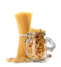Photo of Spaghetti and farfalle pasta isolated on white