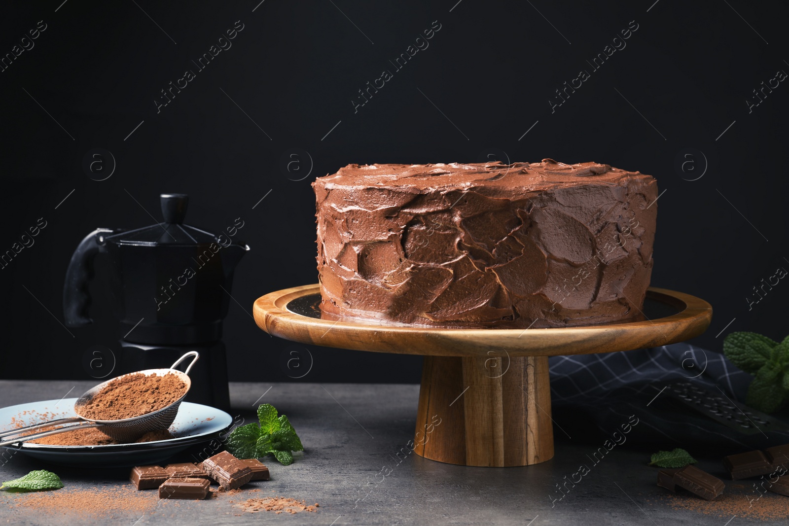 Photo of Composition with tasty homemade chocolate cake on table