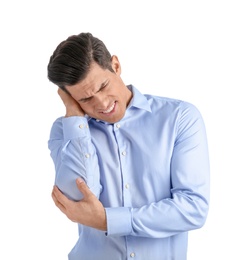 Photo of Young man suffering from pain in elbow on white background