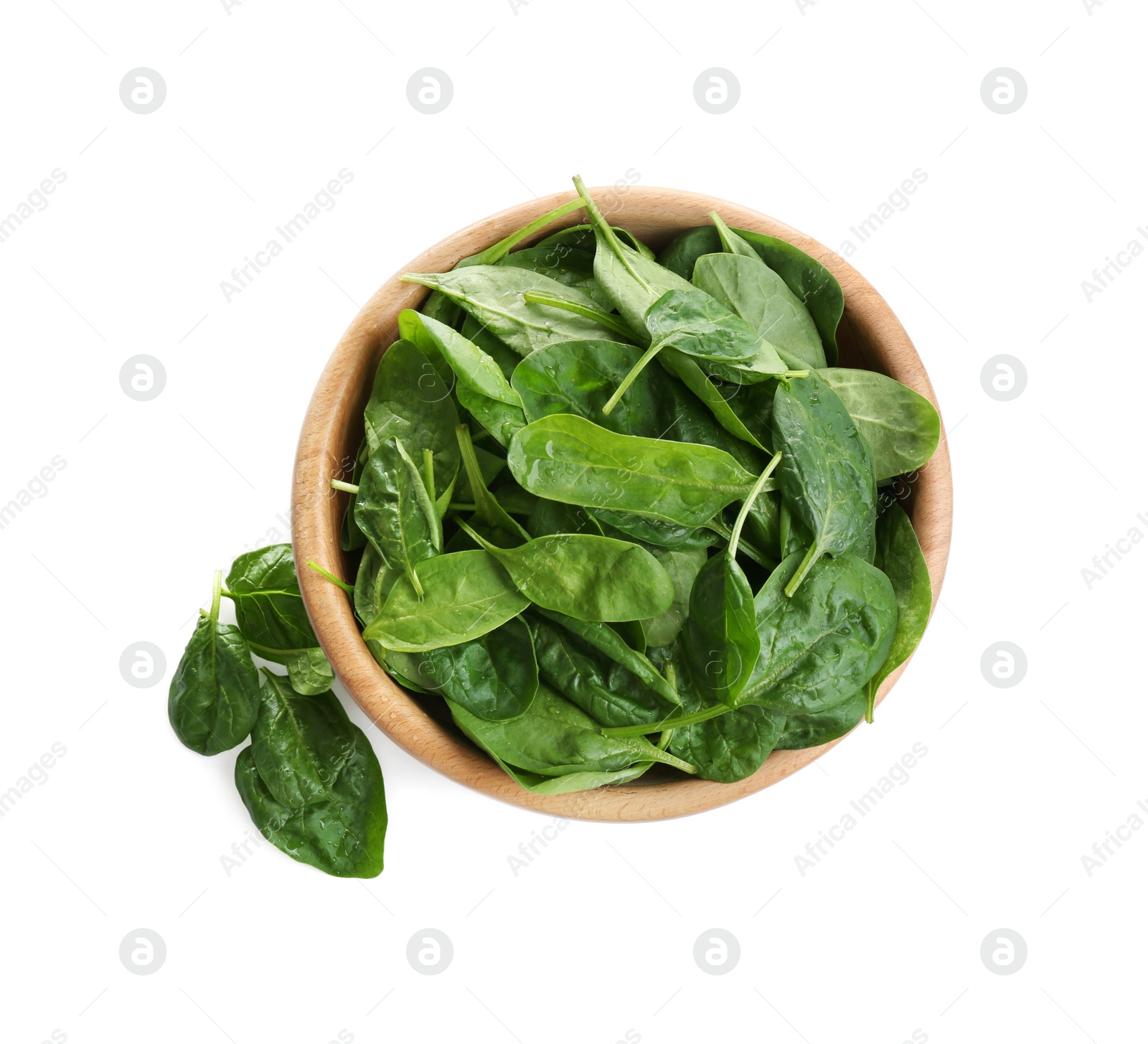 Photo of Fresh green healthy baby spinach leaves in wooden bowl isolated on white, top view