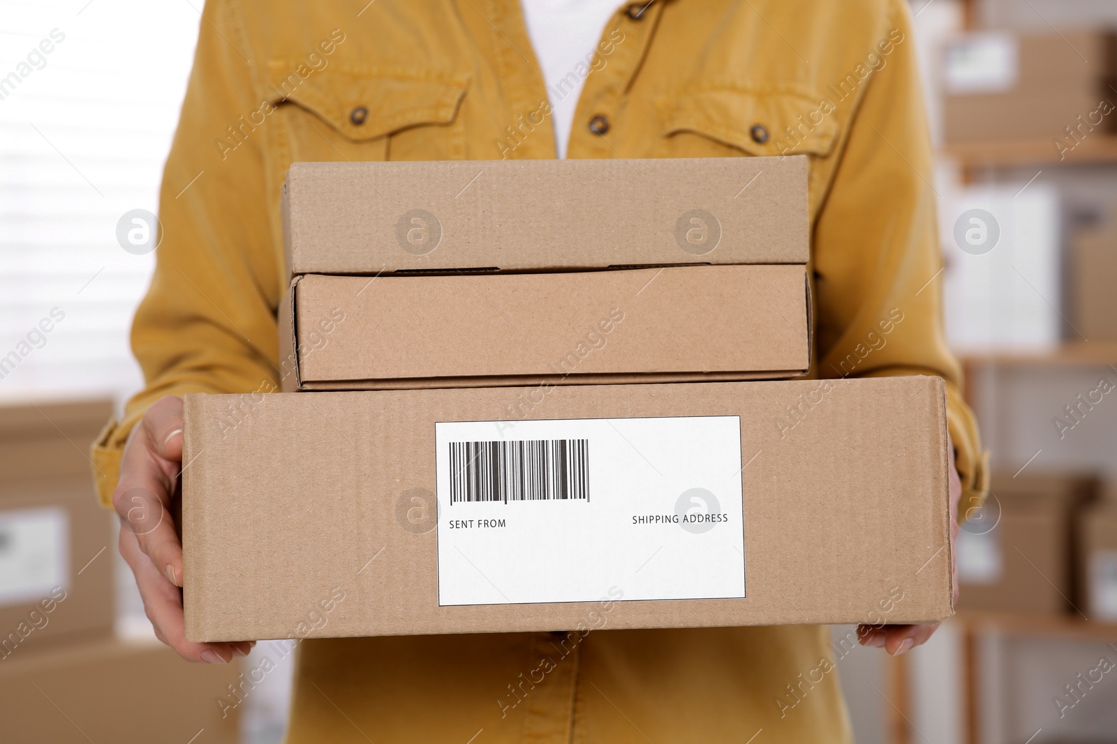 Photo of Seller with parcels in office, closeup. Online store