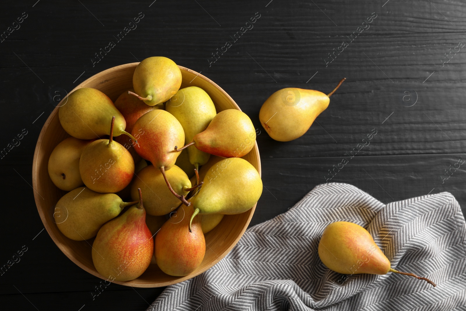 Photo of Flat lay composition with ripe pears on black wooden background