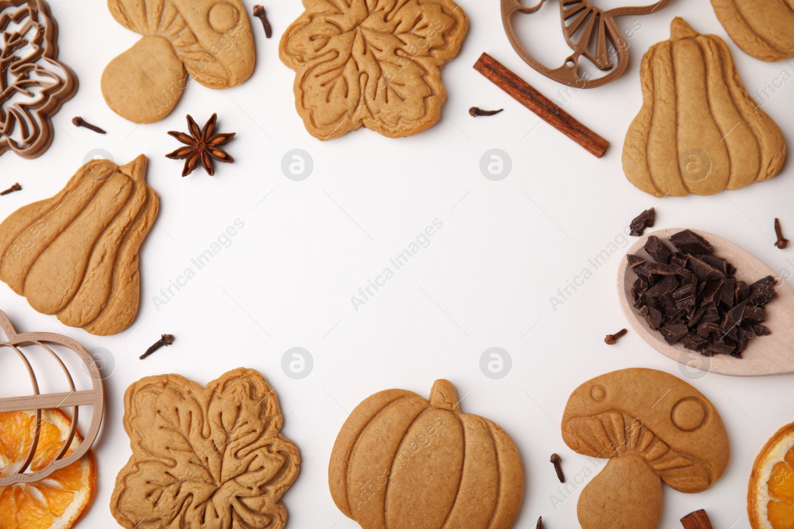 Photo of Frame of tasty cookies, cutters and spices on white table, flat lay. Space for text