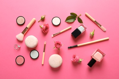 Photo of Flat lay composition with products for decorative makeup on pink background