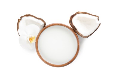 Photo of Wooden bowl of delicious coconut milk, orchid flower and coconuts isolated on white, top view