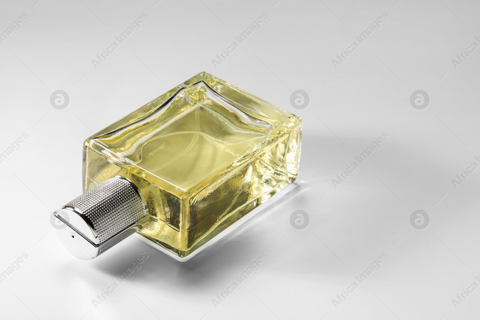 Photo of Luxury men`s perfume in bottle on white background, space for text