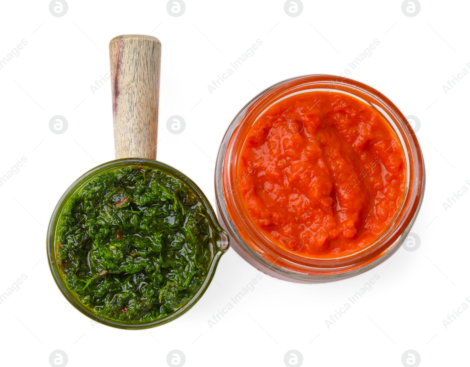 Photo of Different marinades in glassware isolated on white, top view