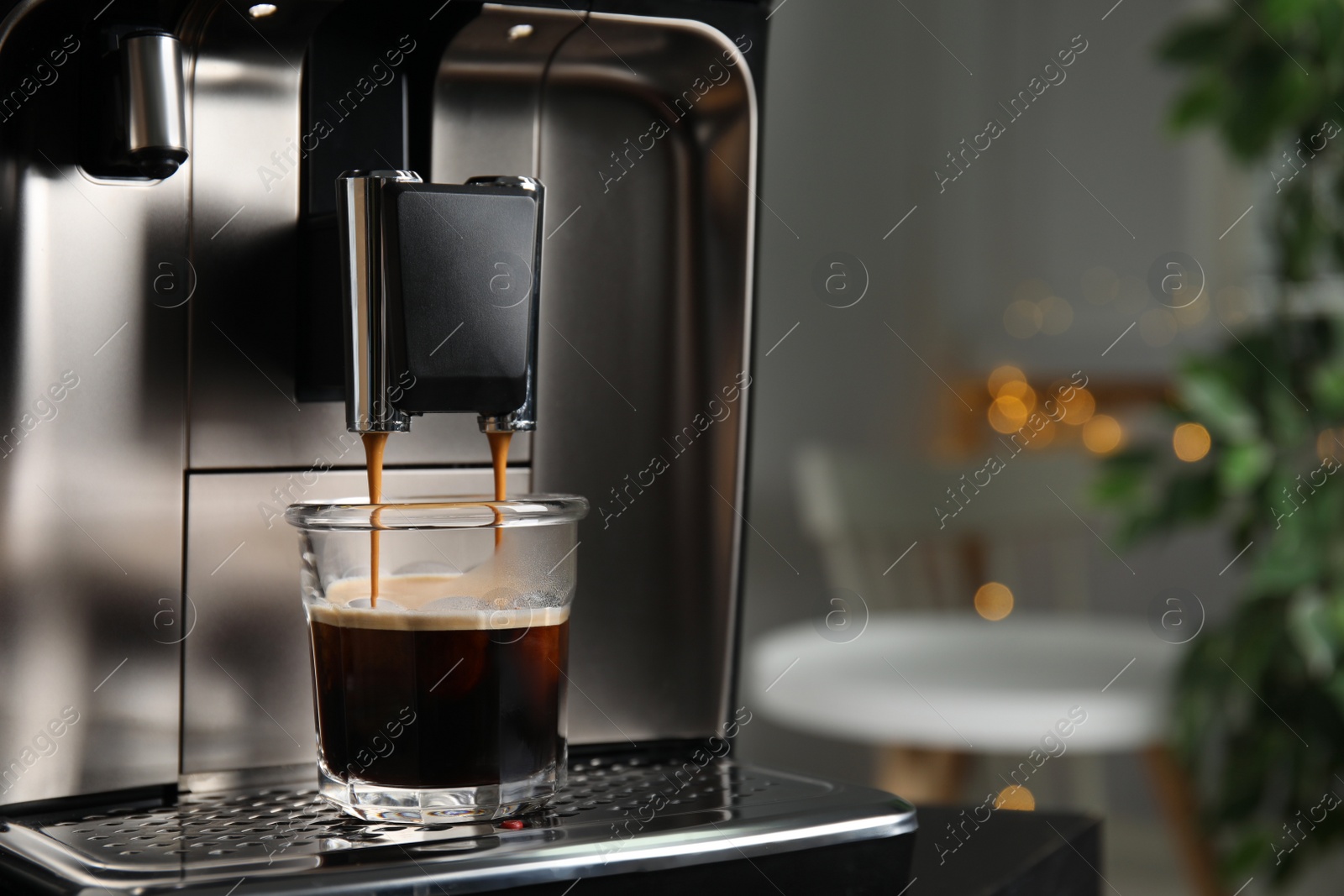 Photo of Espresso machine pouring coffee into glass against blurred background, closeup. Space for text