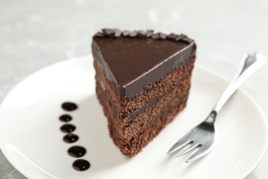 Piece of tasty chocolate cake served on plate