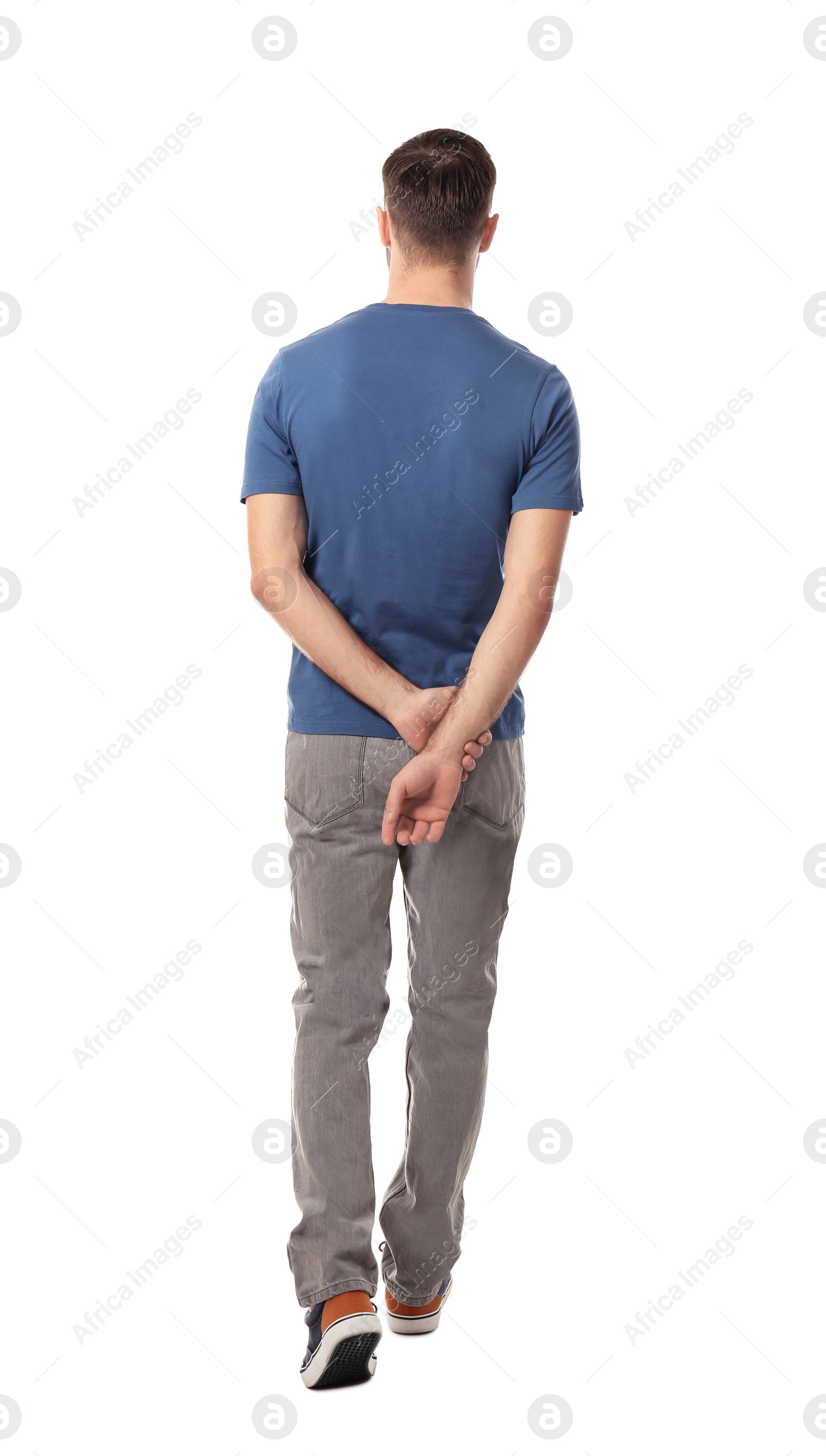 Photo of Young man in casual clothes posing on white background