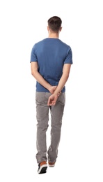 Photo of Young man in casual clothes posing on white background