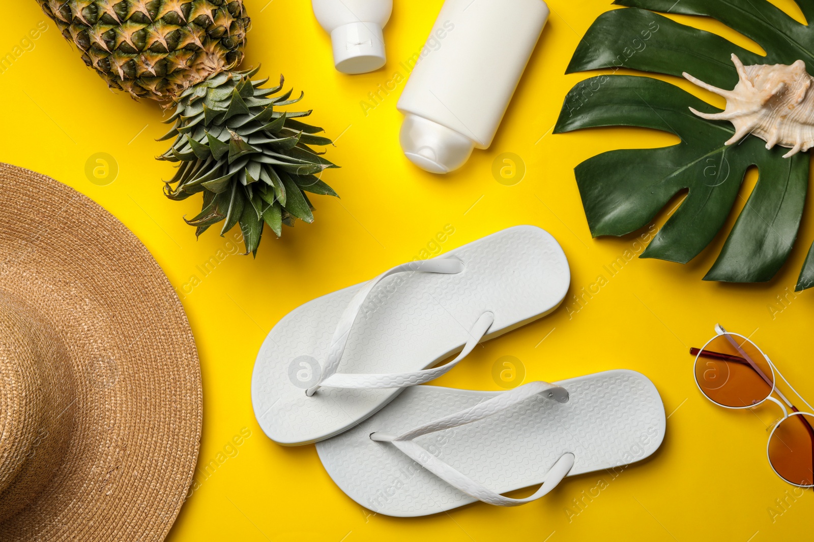 Photo of Flat lay composition with beach accessories on color background